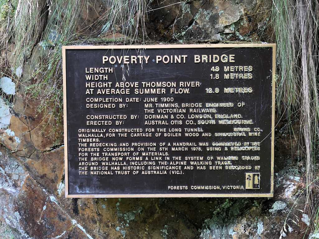Plaque detailing the history of Poverty Point Bridge